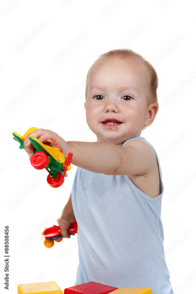 Baby play with toy Airplane in blue dress smiling Baby play with toy Airplane in blue dress smiling