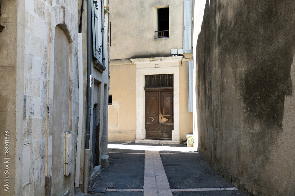 narrow alley with a wooden door in the old town