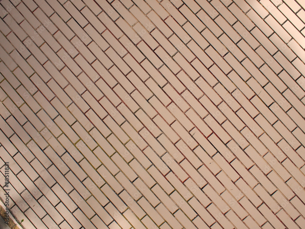 Fragment of a brick wall beige with diagonal image Fragment of a brick wall beige with diagonal image