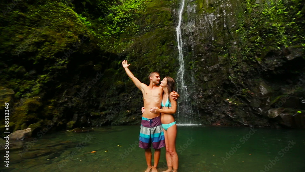 Attractive Young Brunette Model Couple in Love Under a waterfall in Hawaii
Attractive Young Brunette Model Couple in Love Under a waterfall in Hawaii