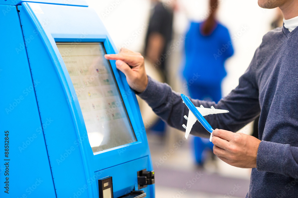 Naklejka premium Close-up self-check-in for flight or buying airplane tickets at