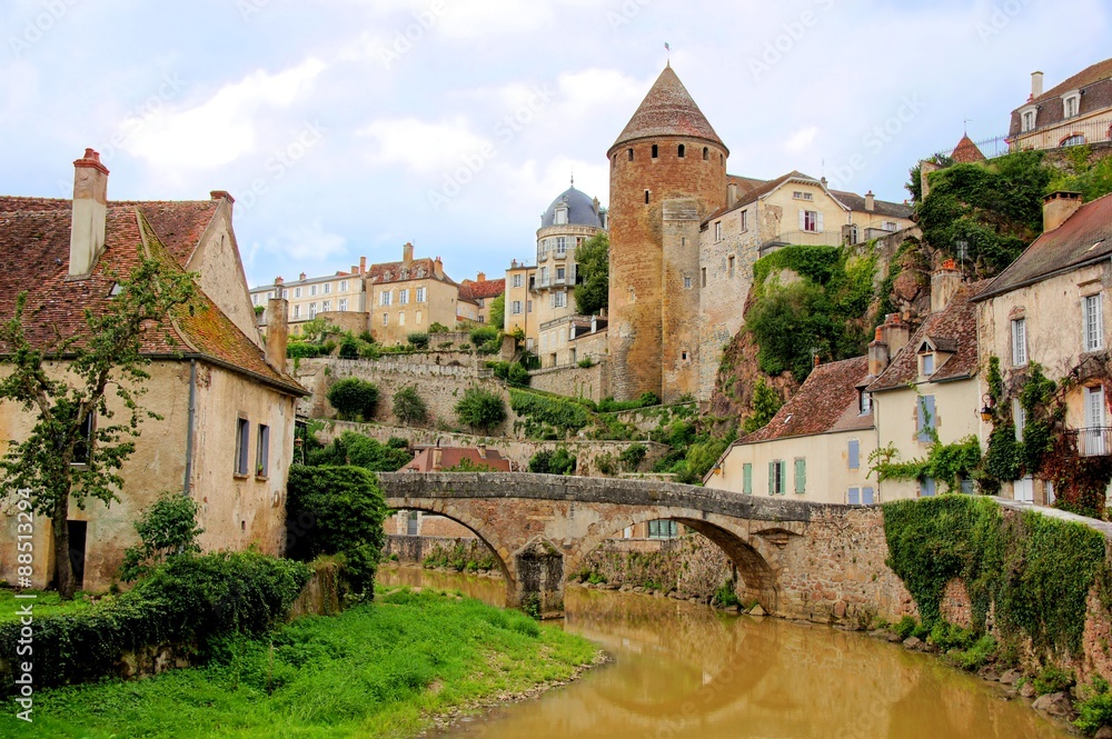 Medieval French village of Semur en Auxois, with old stone bridge Burgundy