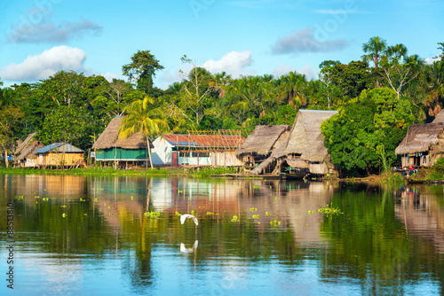 View of a small village in the Amazon rain forest on the shore of the Yanayacu River in Peru