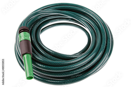 Garden hose coiled up isolated on white