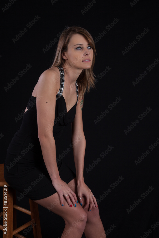 thoughtful woman sitting down thoughtful woman sitting down