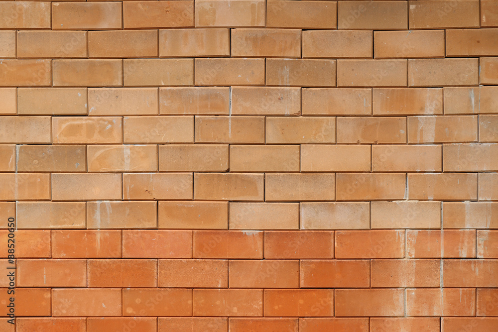 Fototapeta premium Red clay brick wall background.