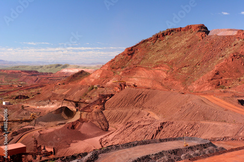 Iron Ore Truck Unloading, Conveyor and Stockpile in the Hamersley Ranges Pilbara Western Australia photo