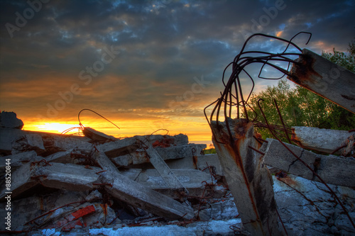 Fotografie Apocalypse.Sunset over the wreckage of buildings.