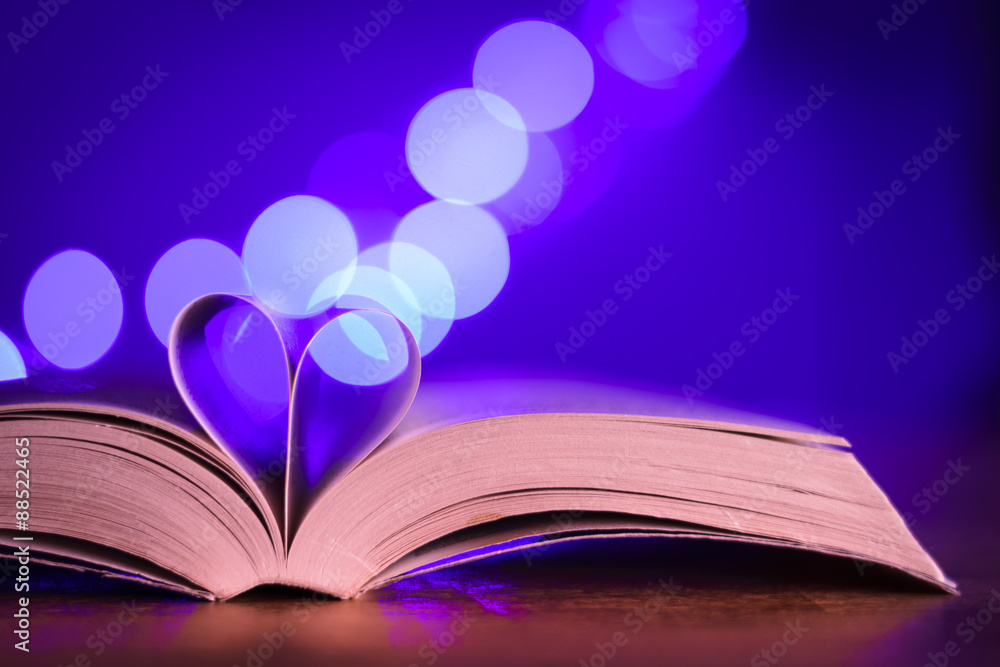 Book with low light and blue bokeh Book with low light and blue bokeh