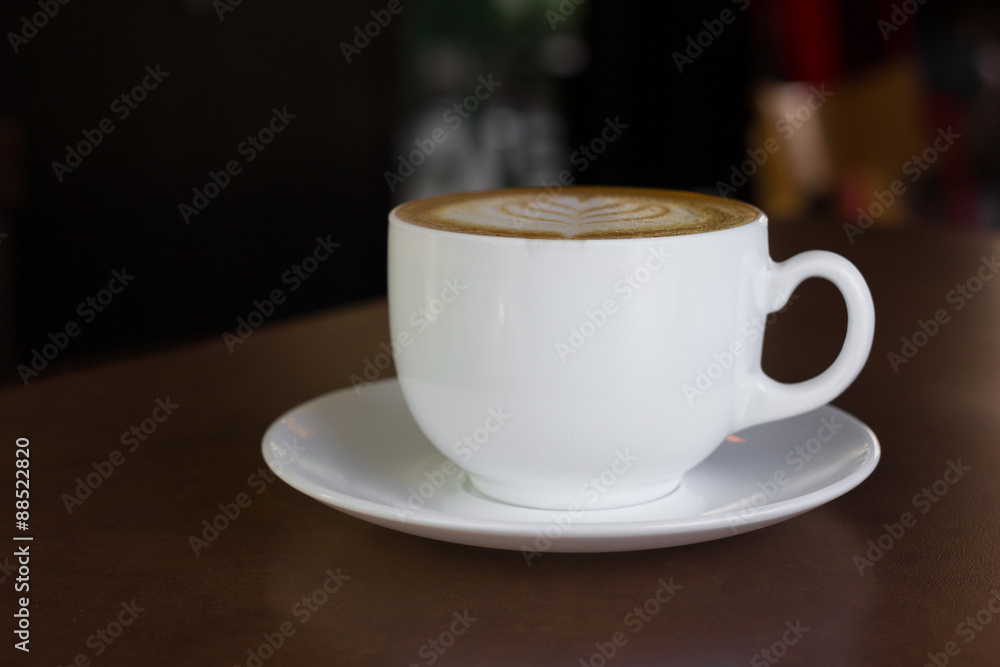Fototapeta premium Cup of art latte or cappuccino coffee.