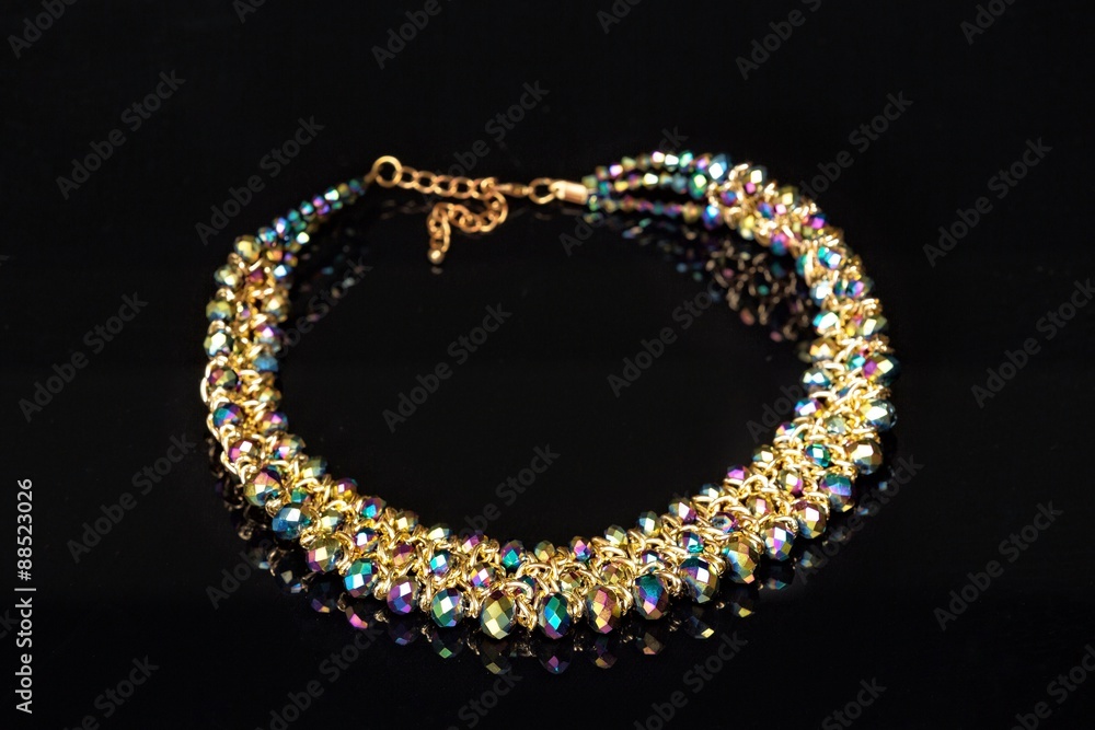 Fototapeta premium Shiny,elegant necklace. Isolated on black background.