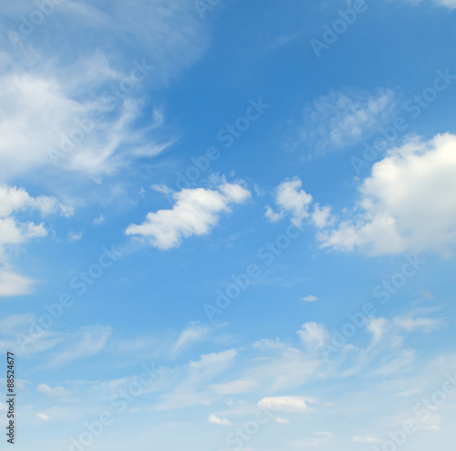 light cumulus clouds in the blue sky