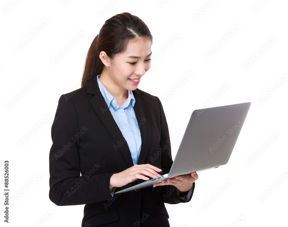 Asian businesswoman read on the laptop computer Asian businesswoman read on the laptop computer