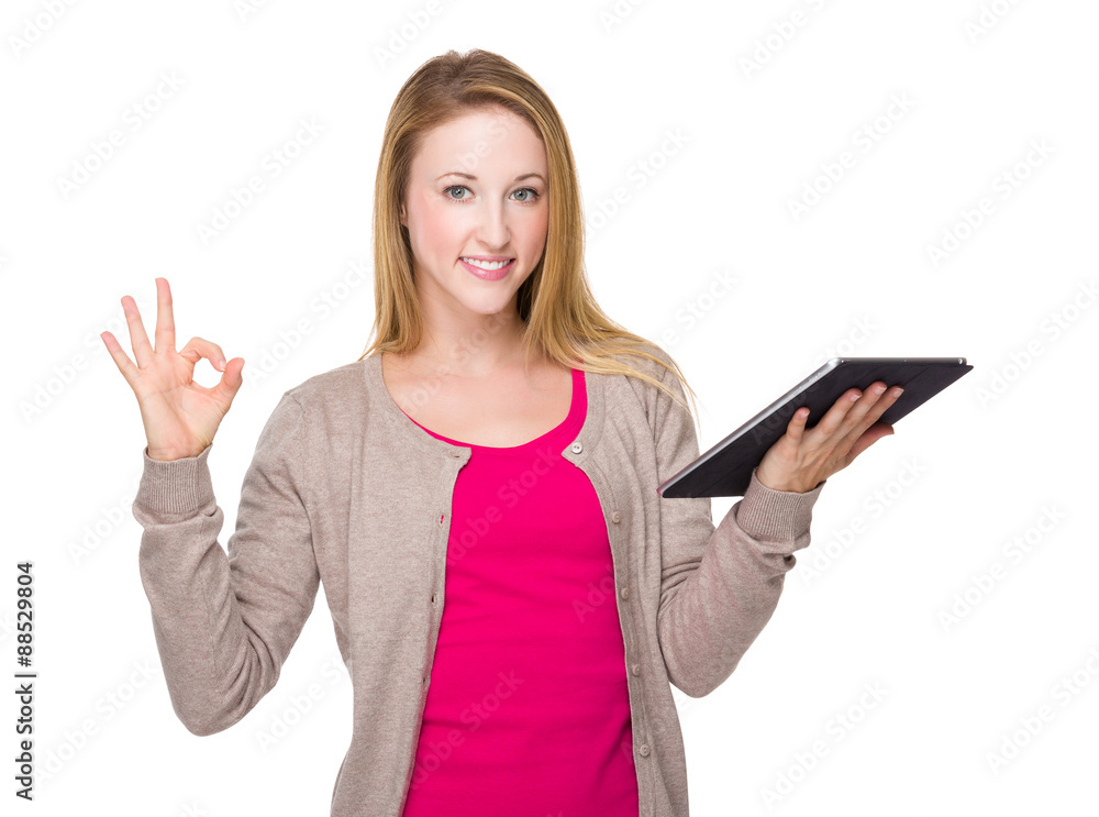 Caucasian woman with tablet and ok sign gesture Caucasian woman with tablet and ok sign gesture