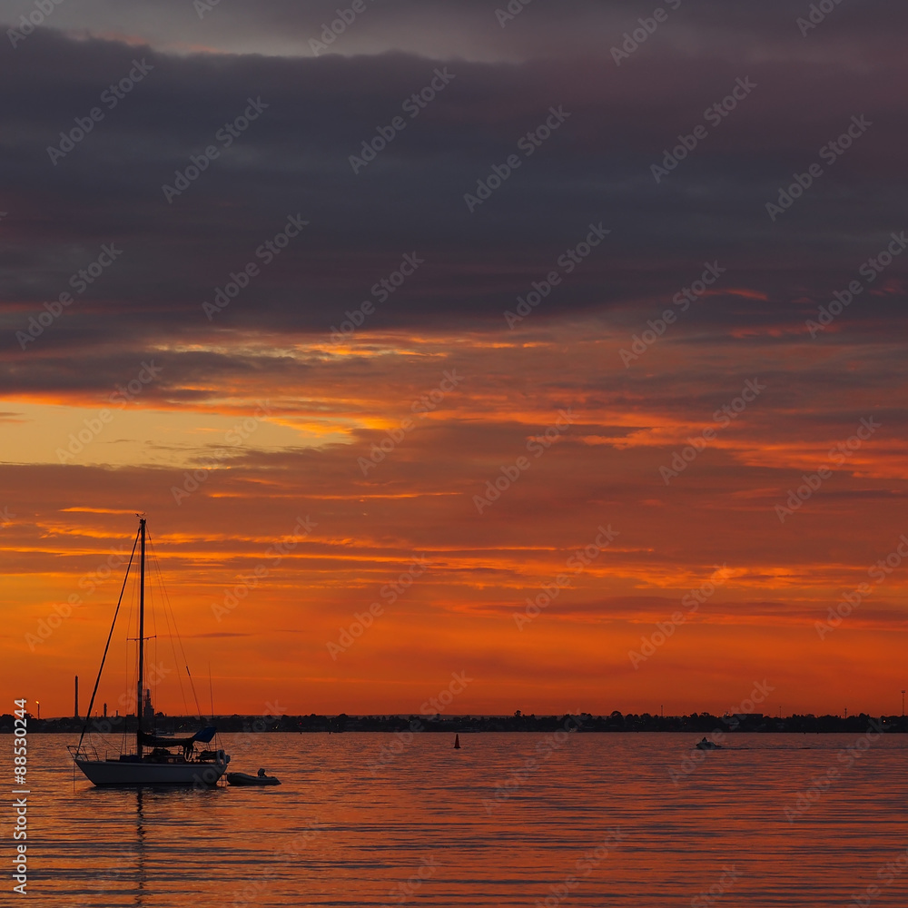 boat at sunset  at St Kilda Beach, Melbourne, Australia. 