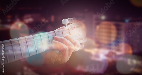 Man playing acoustic guitar with outdoor background photo