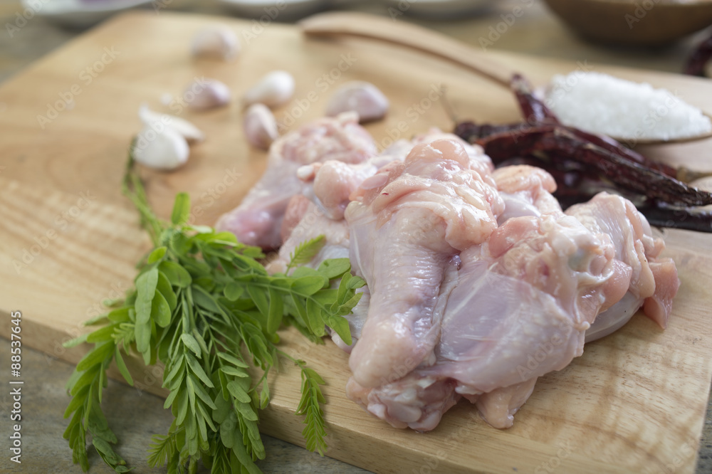 Chicken Wing Stick on the wood chopping block on wood table with ingredient Chicken Wing Stick on the wood chopping block on wood table with ingredient