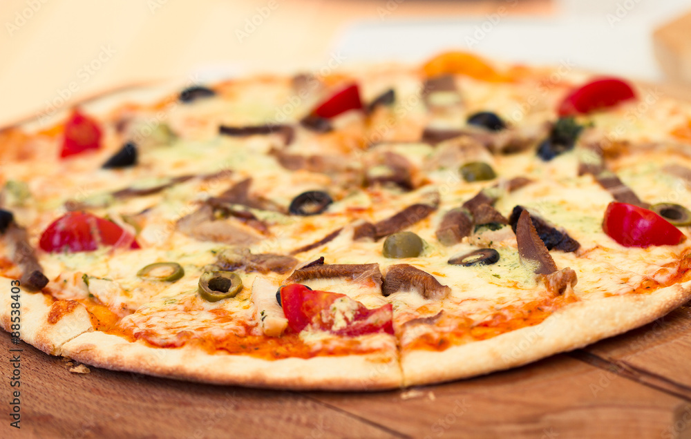 Pizza with meat, tomatoes and olives Pizza with meat, tomatoes and olives