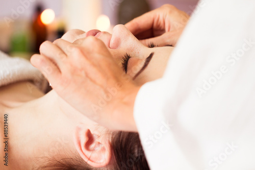 Relaxed woman with a deep cleansing nourishing face mask applied