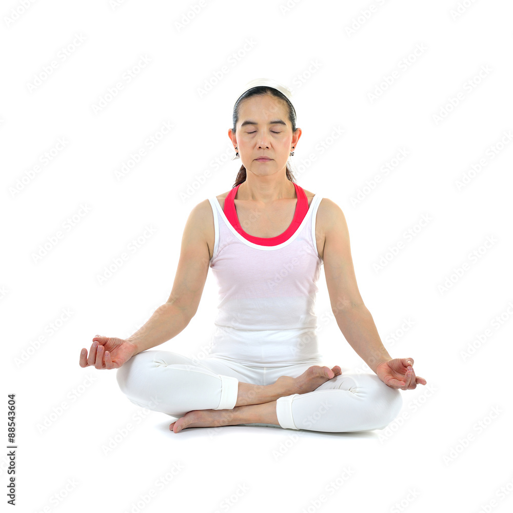 Middle aged woman practicing yoga meditation isolated on white background Middle aged woman practicing yoga meditation isolated on white background