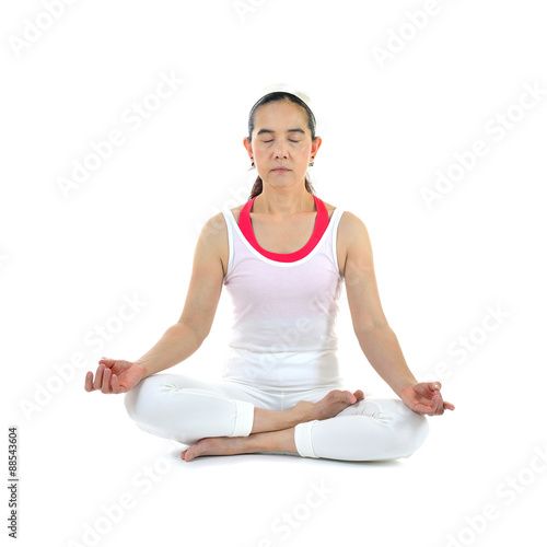 Middle aged woman practicing yoga meditation isolated on white background