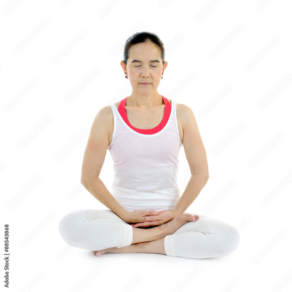 Middle aged woman practicing yoga meditation isolated on white background Middle aged woman practicing yoga meditation isolated on white background