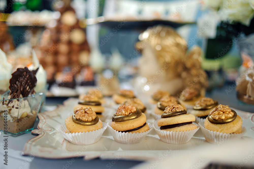 dressing table with sweets, candy pyramid decorated with orange