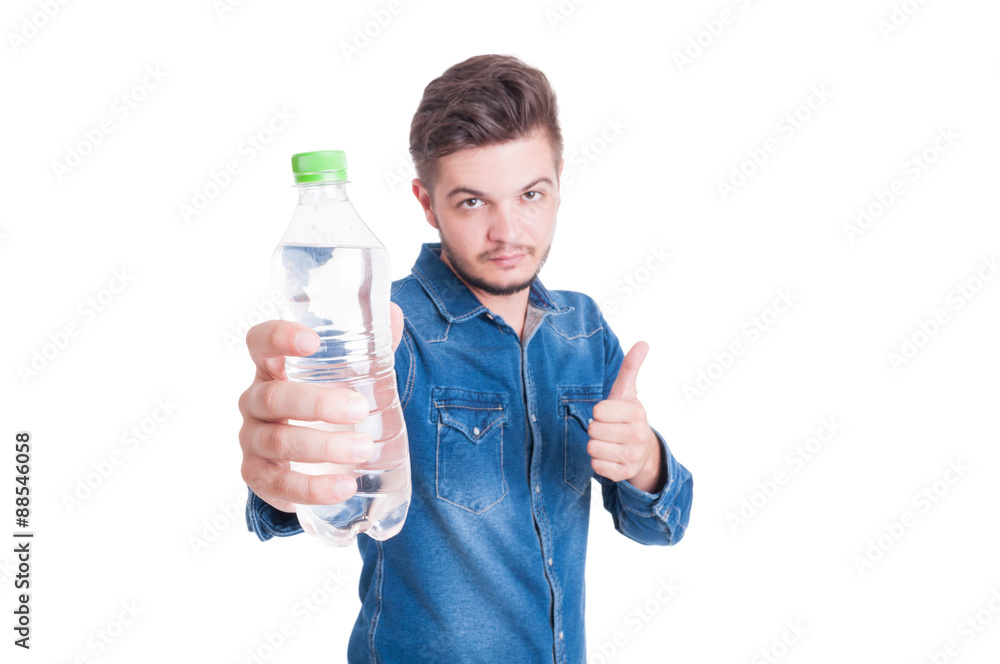 Male model holding water and showing like gesture Male model holding water and showing like gesture