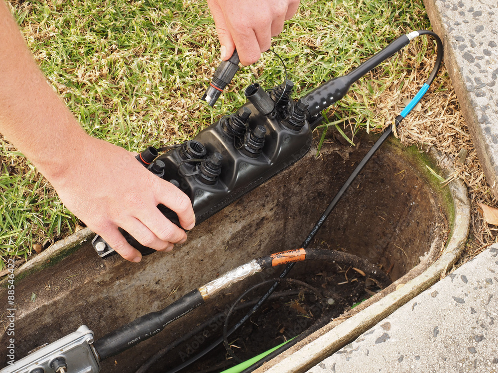 Installation of a customer connection drop cable into a Multiport at a ...