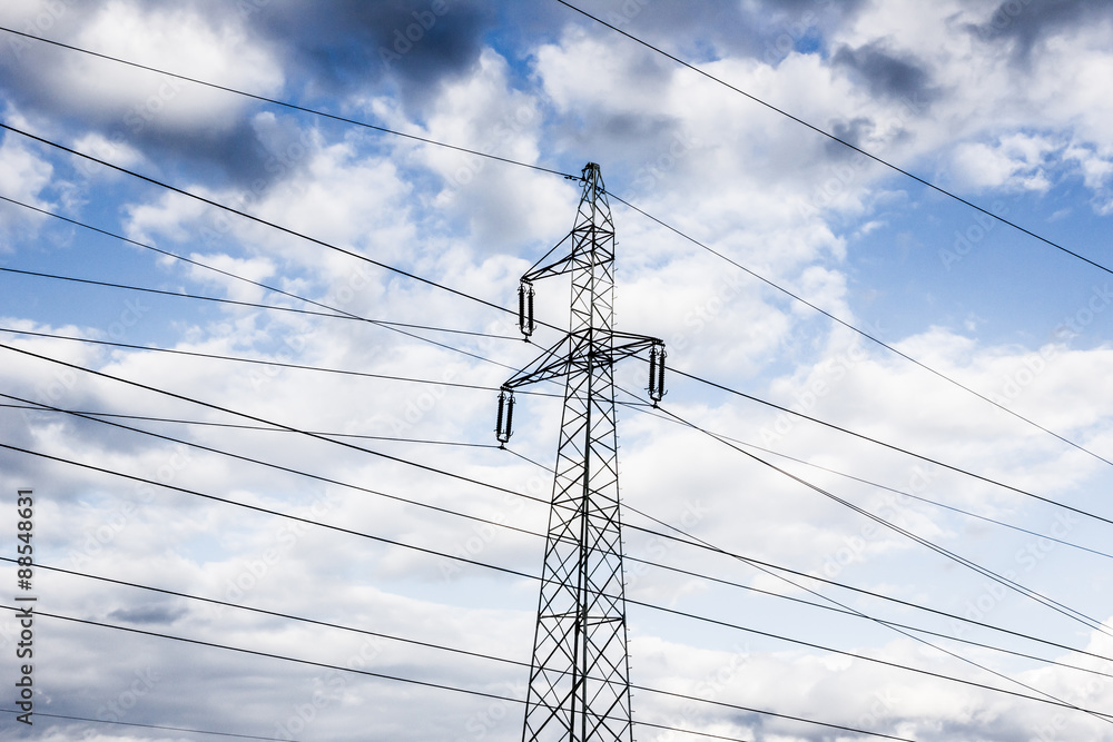 Power tower with cloudy sky in the background. Power tower with cloudy sky in the background.
