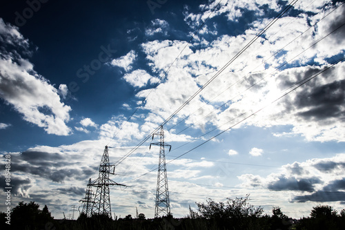 High voltage pylon with blue sky in the background.