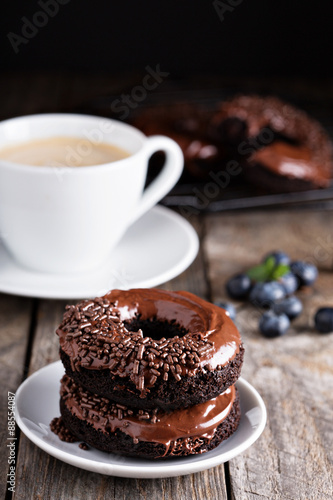 Chocolate donuts with coffee and blueberries