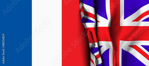 Flag of United Kingdom over the France flag. 