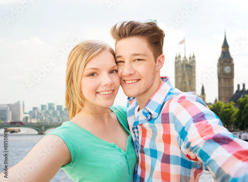 happy couple taking selfie over london city © Syda Productions