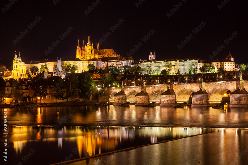 View at night over the RiverVltava with Charles Bridge and the C