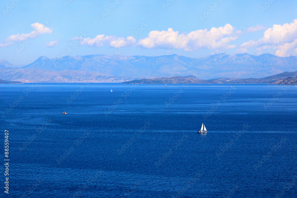 Sea view. Mountain view. View on Albania mointains. Beautiful Ionian dark blue sea. Corfu. Kerkyra. Greece Sea view. Mountain view. View on Albania mointains. Beautiful Ionian dark blue sea. Corfu. Kerkyra. Greece
