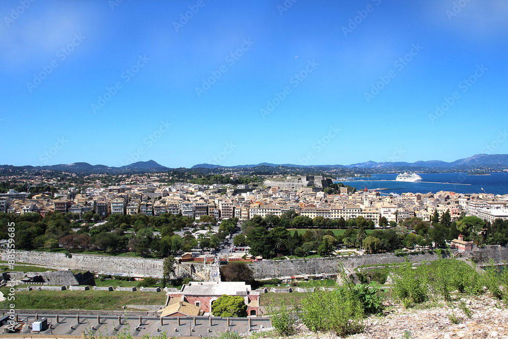 Panorama of the old town. Old town and sea view. White sea liner in the sea bay. Ionian sea. Corfu town. Kerkyra. Greece island