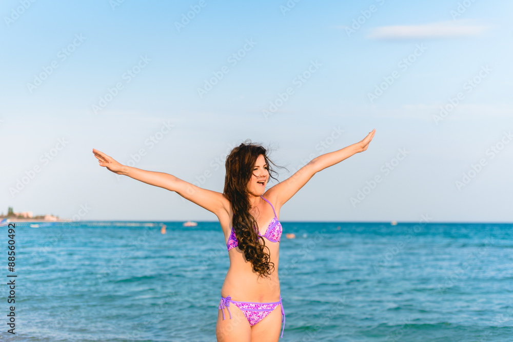 Beautiful girl smiling on the sea