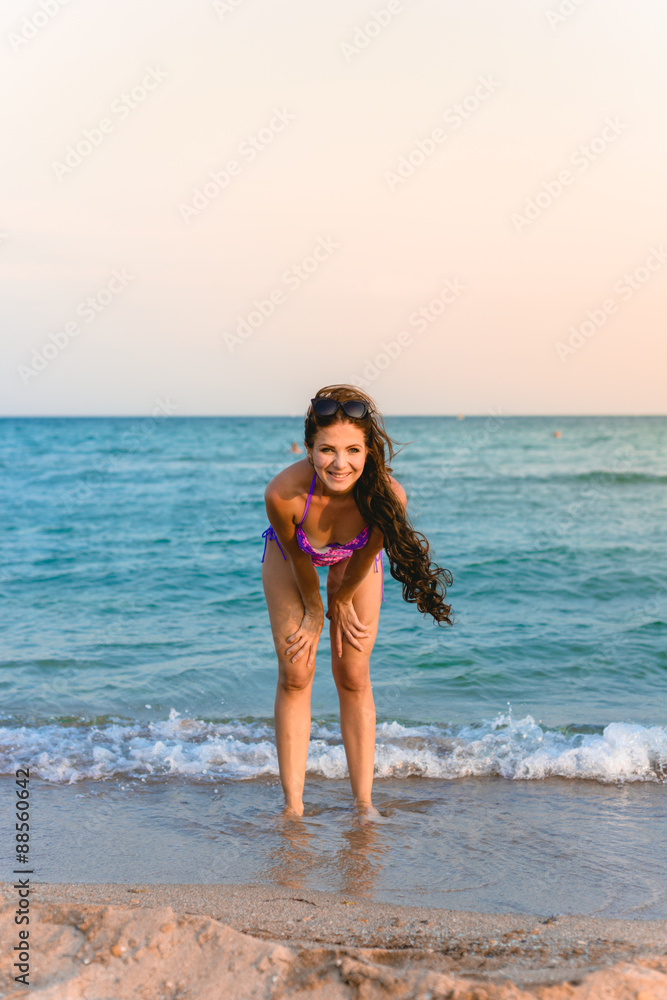 Fototapeta premium Beautiful girl smiling on the sea