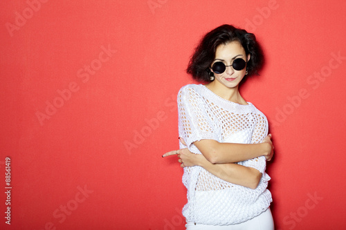 Beautiful girl on red background portrait