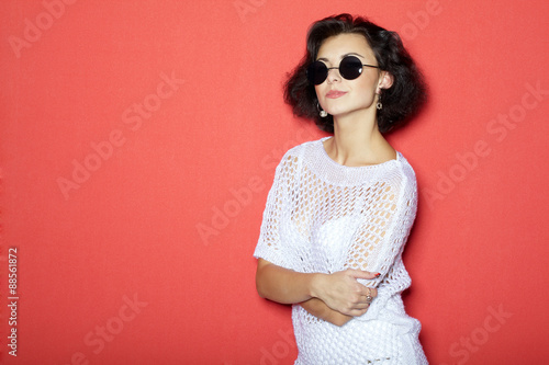 Beautiful girl on red background portrait