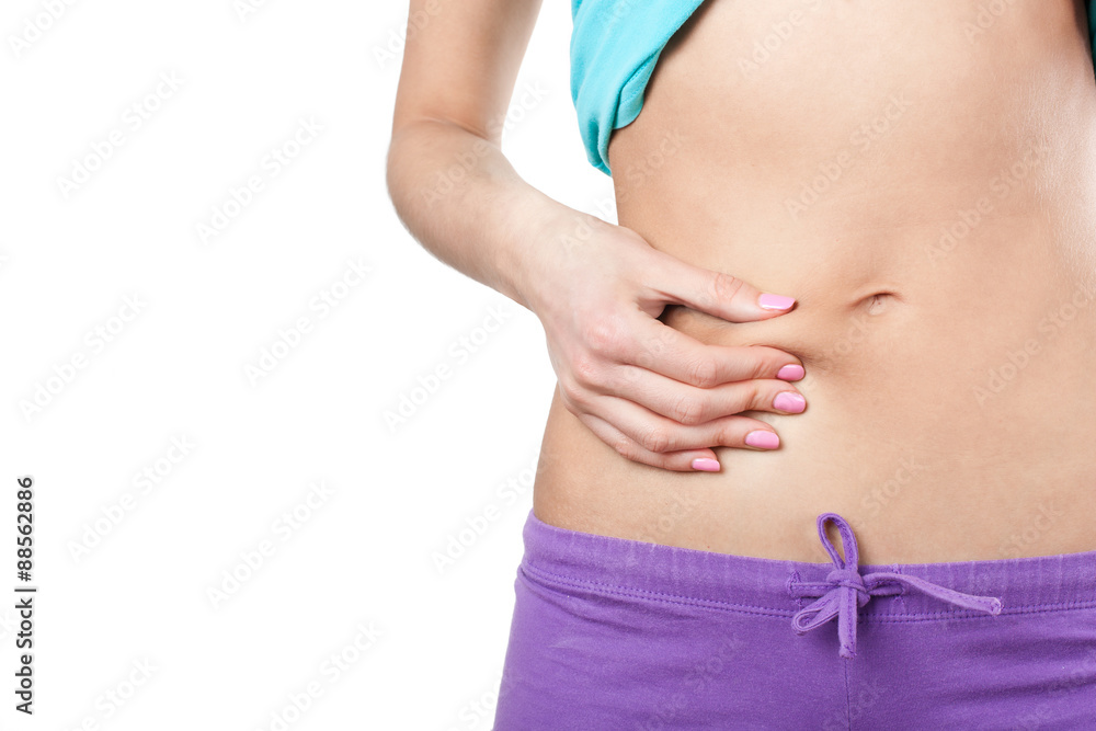 Woman showing cellulite on her belly Woman showing cellulite on her belly