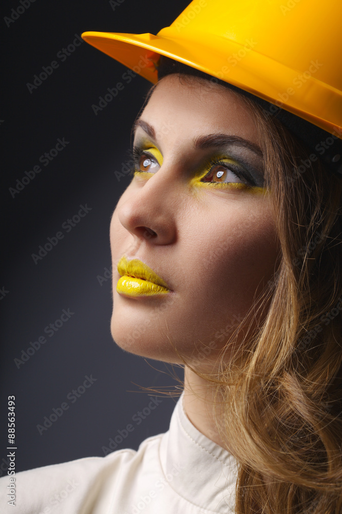 Beautiful girl with yellow helmet portrait Beautiful girl with yellow helmet portrait
