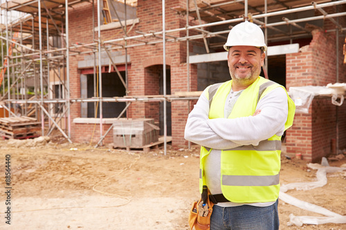 Portrait Of Construction Worker On Building Site photo