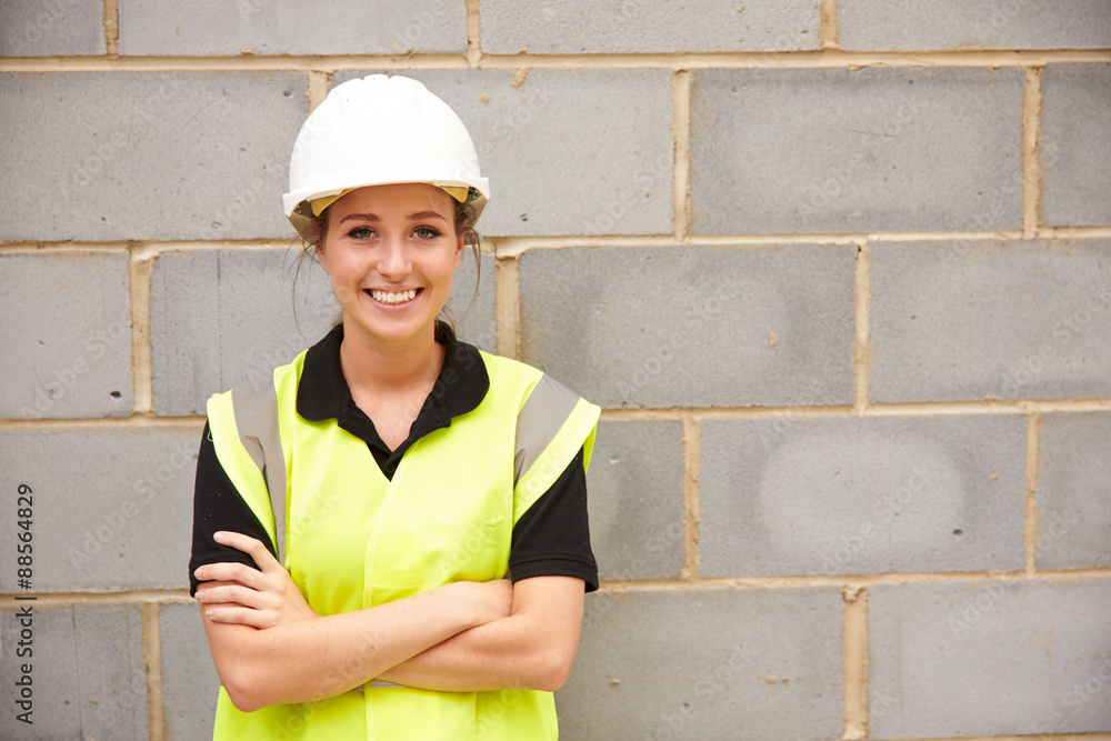 Portrait Of Female Construction Worker On Building Site Portrait Of Female Construction Worker On Building Site