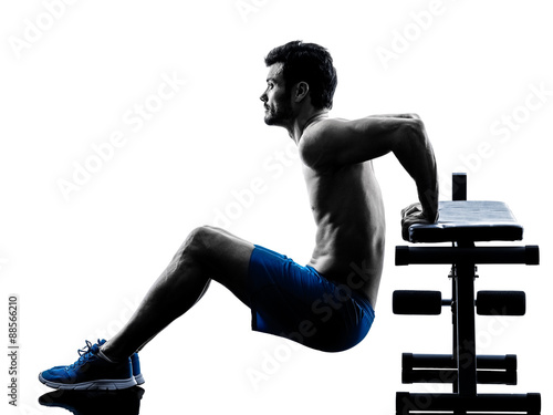 Fototapeta man exercising fitness crunches Bench Press exercises silhouette