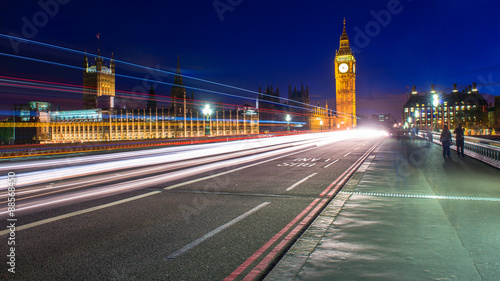 Big Ben tower, night shot with cars crossing the bridge.
