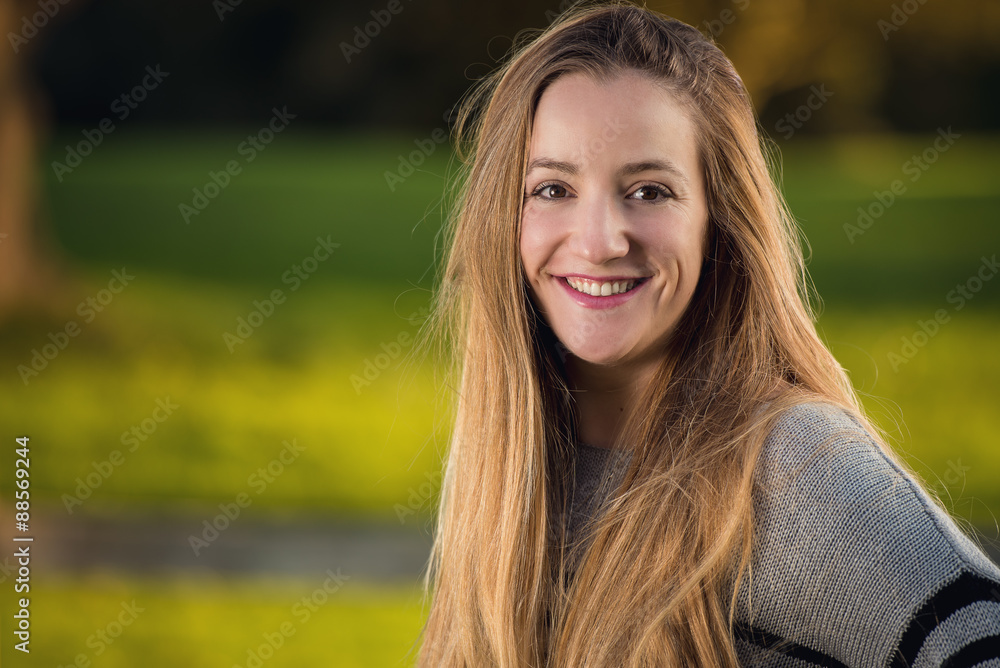 Portrait of a young woman at urban park Portrait of a young woman at urban park