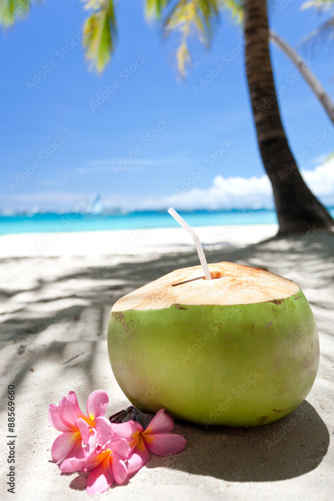 Tropical fresh cocktail on white beach Tropical fresh cocktail on white beach
