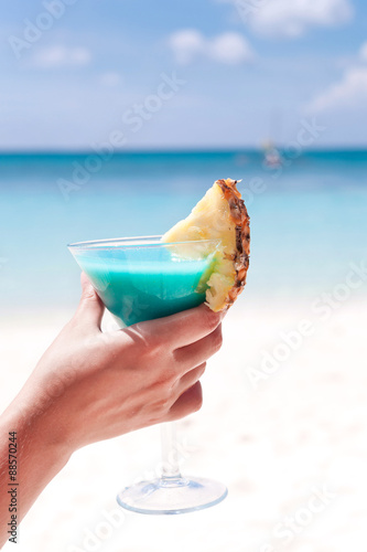 Blue Curacao cocktail in female hand